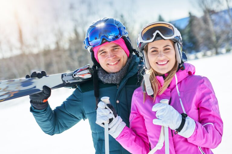 young-couple-having-fun-while-winter-skiing.jpg